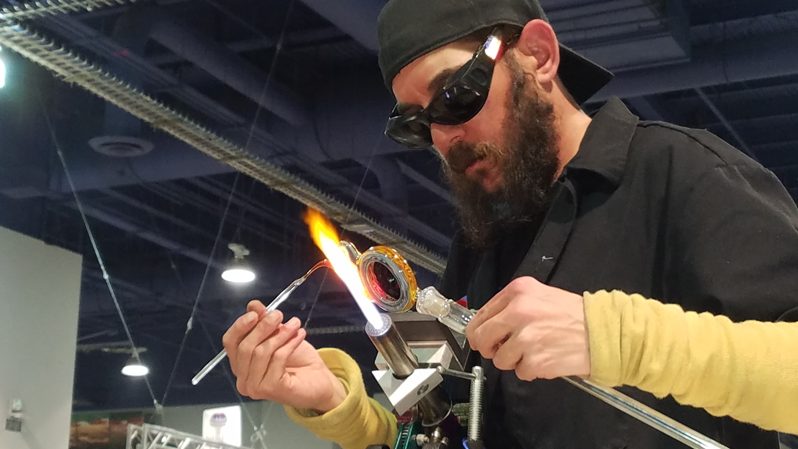 Glassblower making glass art